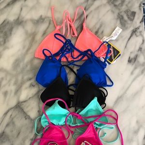 6 bikini tops, $20 for the lot, all are XS.